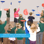 Group of children plate spinning.